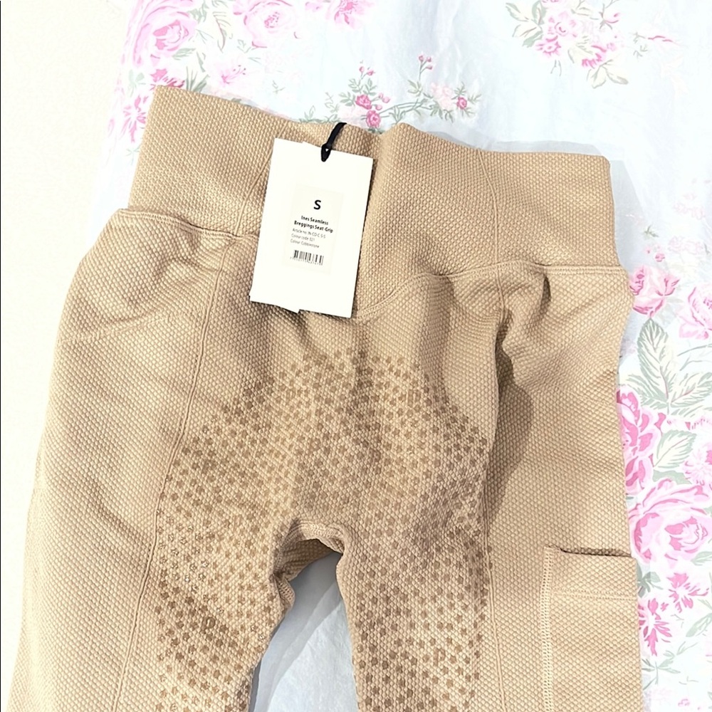 Ridding legging with grips to hold on to a bike or horse